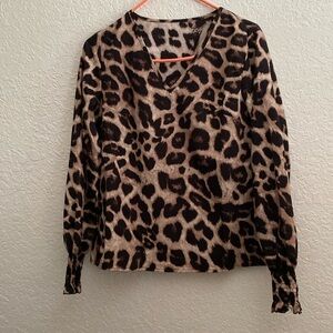 Woman’s blouse, size Small, leopard print, polyester
